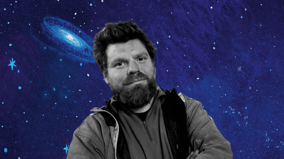 Black and white picture of artist Paddy Bloomer against a blue coloured outer space backdrop