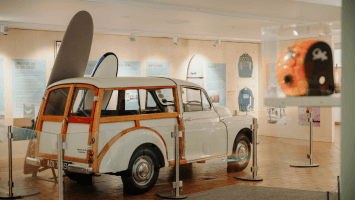 Morris Traveller, surfboard and helmet on display in Celtic Wave exhibition